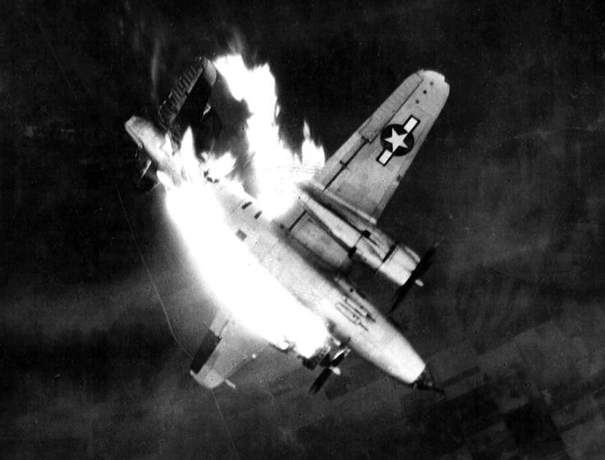 Bomber "Marauder" B-26, serial number 43-34565, Gratis Gladys, 7I-B, 497 Squadron, 344th Bombardment Group, 9th U.S. Air Force is crashing to the ground after receiving a direct hit in the left engine during the bombing of a Erkelenz, Germany, 26 Feb 1945. MACR 12649